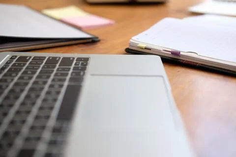 Computer notebook stationary on library desk. back to school learning educati Stock Photos