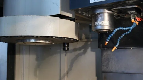 Computer Numerical Control (CNC) Machine switching between tools. Stock Footage 119187872