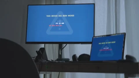 Computer in office or home showing warning message by hacker for ransom payment Video stock 342512275