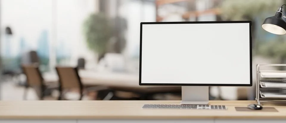 A computer with office supplies on a table with a blurred background of a c.. Stock Illustration