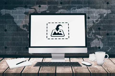 A computer over a desk  against a dark wall 스톡 일러스트