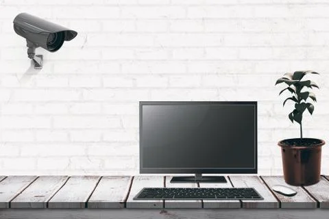 A computer over a desk  against white wall Illustrazione stock