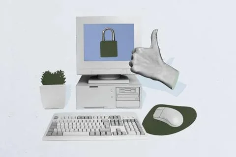 Computer with padlock on screen and thumbs up hand Foto stock