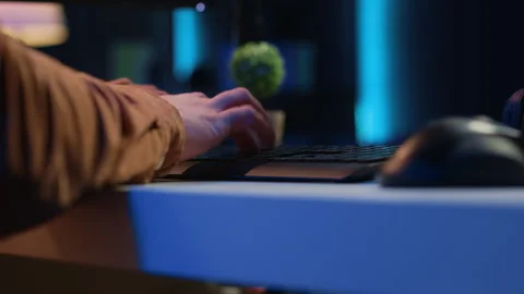 Computer peripherals used by programmer to write lines of code on computer Stock Footage 265510770