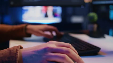 Computer peripherals used by programmer to write lines of code on computer Stock Footage 265617932