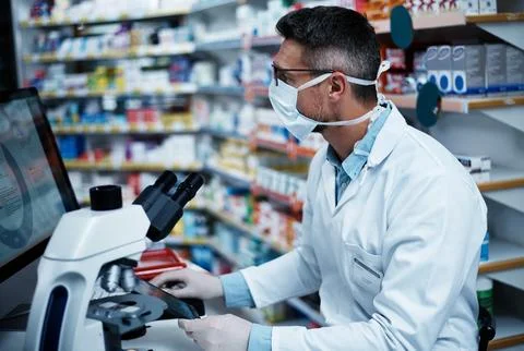 Computer, pharmacy and face mask with man in store for drug development, he.. Stock Photos
