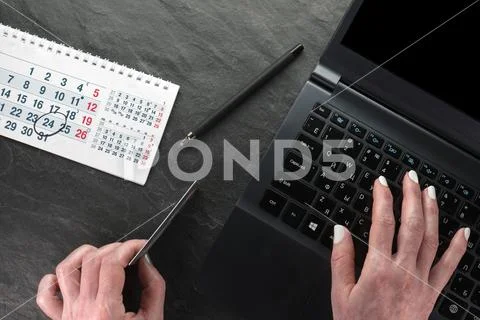 Computer, plastic card and hands, calendar, black Friday close-up Stock Photos