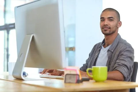Computer, portrait and typing with graphic designer man at desk in office f.. Foto stock