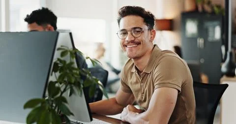 Computer, portrait and web development with smile of man in creative workplace 写真素材
