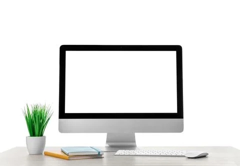 Computer, potted plant and notebook on table against white background. Styl.. Foto stock