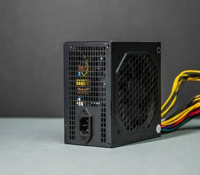 Computer power supply unit with power socket and cables. Stock Photos