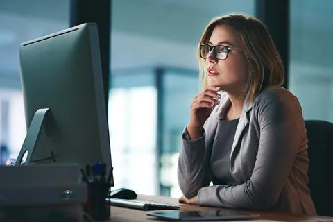 Computer, problem solving and business woman in office working late on project Stock Photos