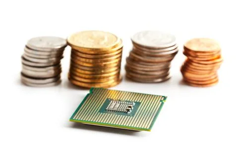 Computer processor and coins Stock Photos