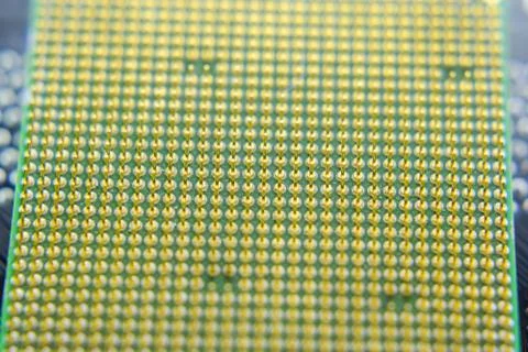 Computer processor, contact feet. Electronic board with electrical components 库存照片