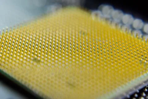 Computer processor, contact feet. Electronic board with electrical components Stock Photos