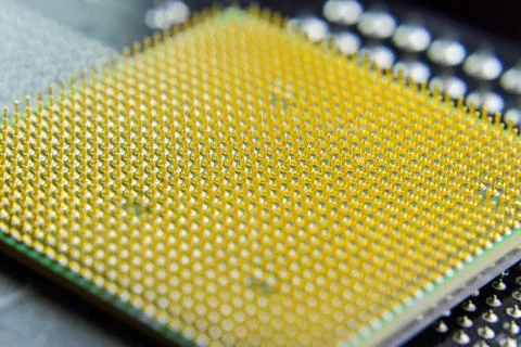 Computer processor, contact feet. Electronic board with electrical components Stock Photos