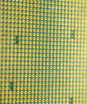 Computer processor, contact feet. Electronic board with electrical components Stock Photos