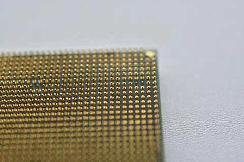 Computer processor with contact legs on a white background 写真素材