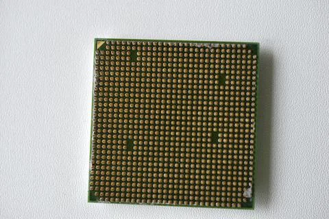 Computer processor with contact legs on a white background Stock Photos