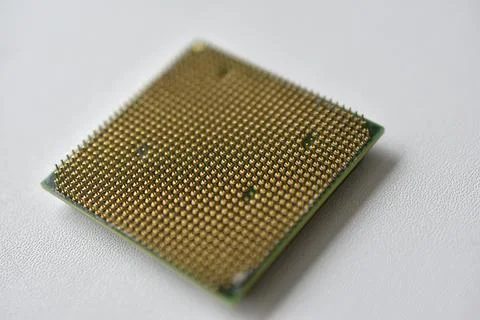 Computer processor with contact legs on a white background 写真素材