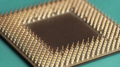 The Computer Processor CPU with Gold Plated Contacts Spins on Green Background Stock Footage 145917210