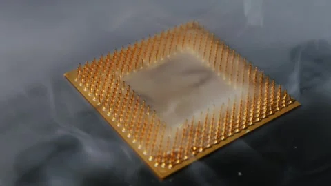 Computer Processor with Gold Pins Emerging from White Smoke Stock Footage 325802351