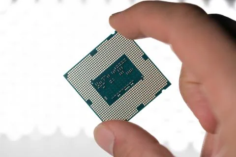 Computer processor in hand Stock Photos