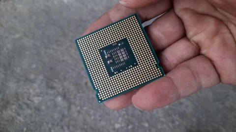 A computer processor holding a person, the brain of a technology Stock Footage 255518239