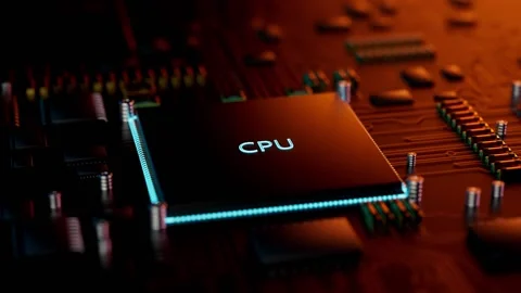 Computer processor located on a printed circuit board, illuminated by colored Stock Footage 234922021