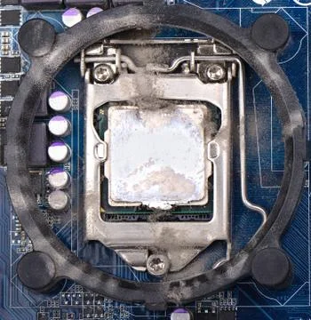Computer processor on the motherboard is covered with dust. Need Foto stock