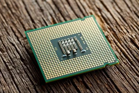 Computer processor on old wooden background 写真素材