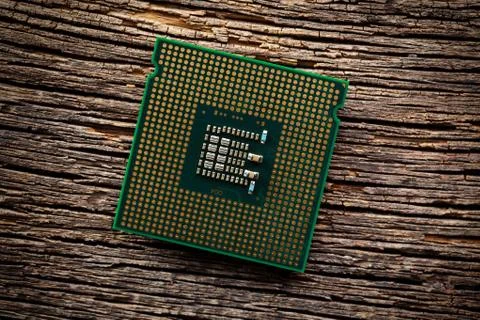 Computer processor on old wooden background Stock Photos