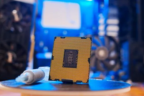 Computer processor with thermal paste close up. Modern computer part with PC Stock Photos