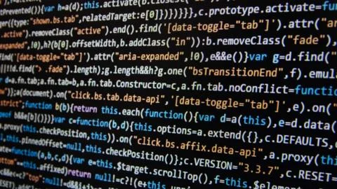 Computer program code on a black background. Close-up. High quality photo Stock Photos