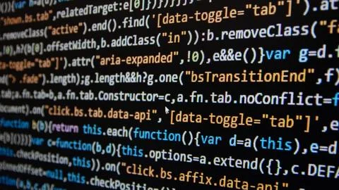 Computer program code on a black background. Close-up. High quality photo Foto stock