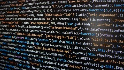 Computer program code on a black background. Close-up. High quality photo Stock Photos