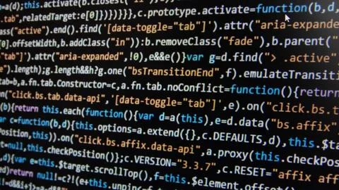 Computer program code on a black background. Close-up. High quality photo Stock Photos