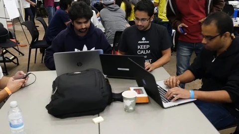 Computer Programers coming up with a plan to build software at a Hackathon Stock Footage 93171329