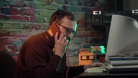 Computer Programmer From 1980's in His Home Office Listening Music and Stock Footage 306659655