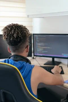 Computer programmer busy coding in his studio Foto stock