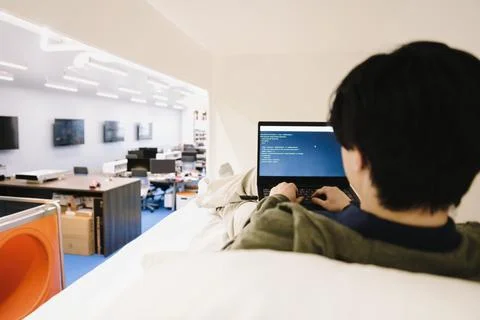 Computer programmer coding at laptop in office Stock Photos