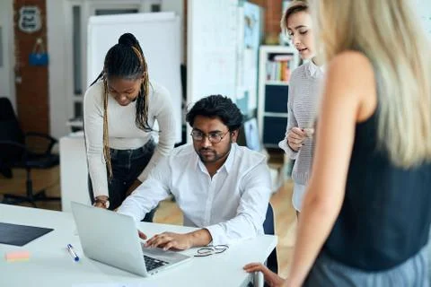 Computer programmer is fixing the laptop at workplace Foto stock