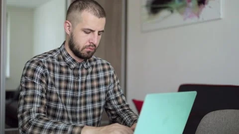 A computer programmer.. Information Technology. The guy works from home... Stock Footage 192459915