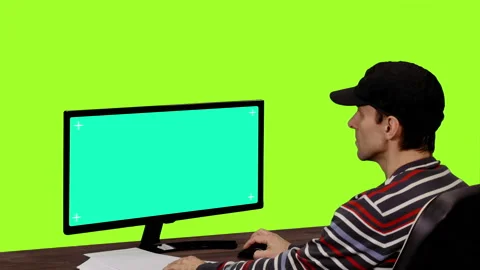 Computer programmer looking at mockup green screen, Chroma key Stock Footage 86193126