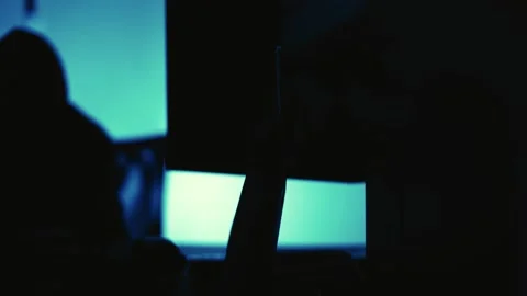A computer programmer or hacker prints a code on a laptop keyboard to break i Stock Footage 138948900