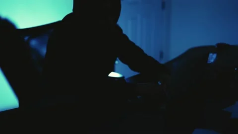 A computer programmer or hacker prints a code on a laptop keyboard to break i Stock Footage 138949333