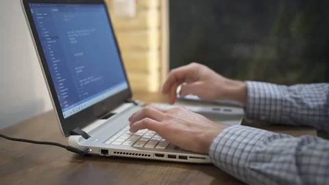 Computer programmer typing code on keyboard. Stock Footage 147565384