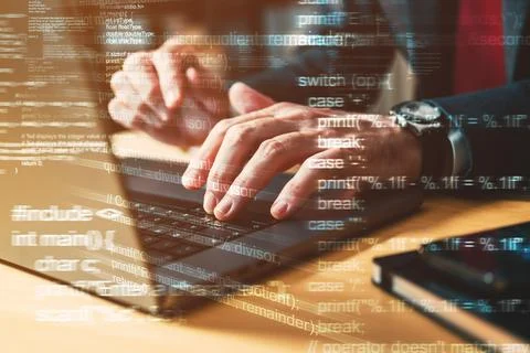 Computer programmer typing laptop keyboard Stock Photos