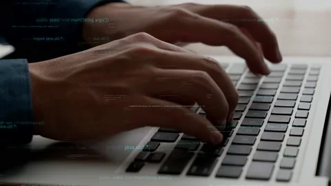 Computer programmer uses capable laptop computer to develop programming code Stock Footage 171359287