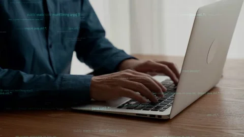 Computer programmer uses capable laptop computer to develop programming code Stock Footage 172119111